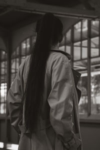 Young woman standing on the platform.