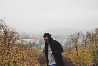 Man in sunglasses against clear sky