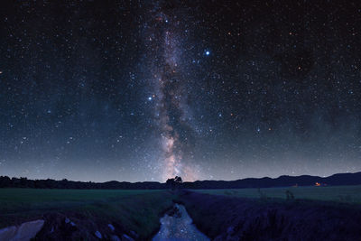 Scenic view of star field against sky at night