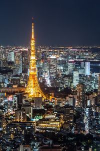 Illuminated buildings in city at night