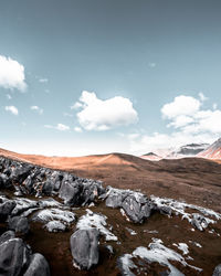 Scenic view of snowcapped mountains against sky