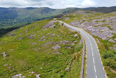 High angle view of road amidst mountains against sky