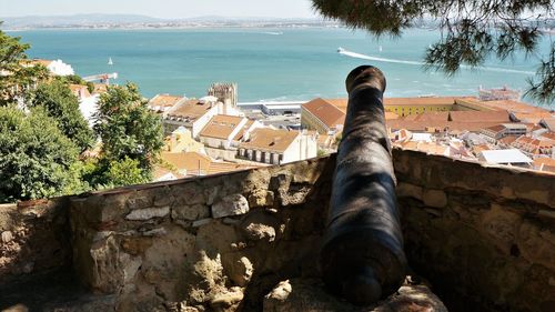 High angle view of buildings by sea