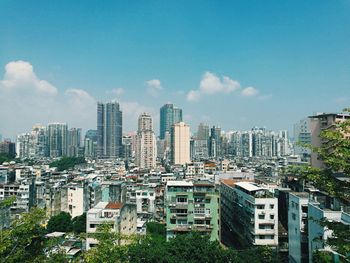 High angle view of buildings in city against sky