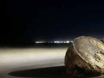 Scenic view of sea against sky at night
