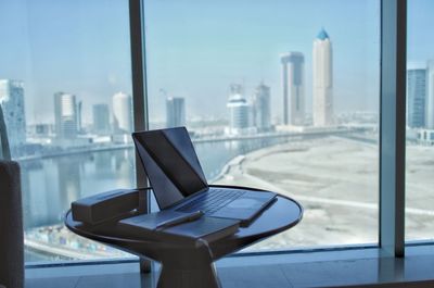 Modern buildings seen through glass window