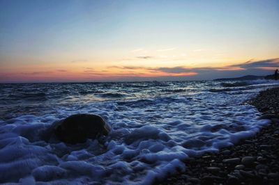 Scenic view of sea at sunset