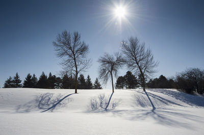 Scenic view of snow covered landscape against sky