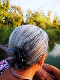 Rear view of woman with eyes closed