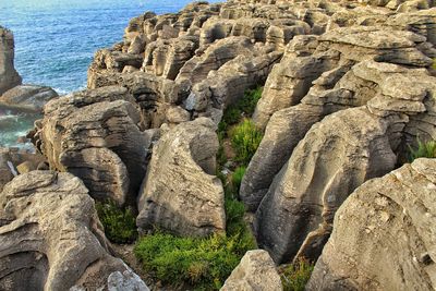 Sculpture of rock formation on sea