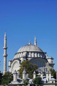 Low angle view of temple against blue sky