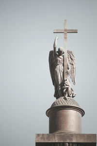 Low angle view of statue against sky