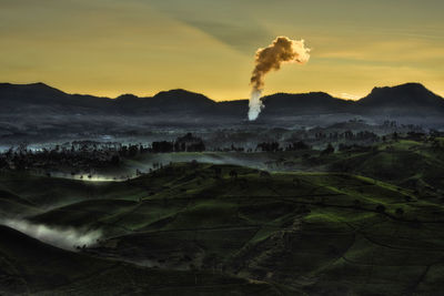 Scenic view of landscape against sky during sunset