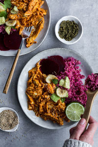 Plates with red quinoa and chicken curry