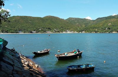 High angle view of boats in lake against sky