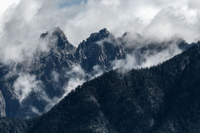 Low angle view of majestic mountains against sky