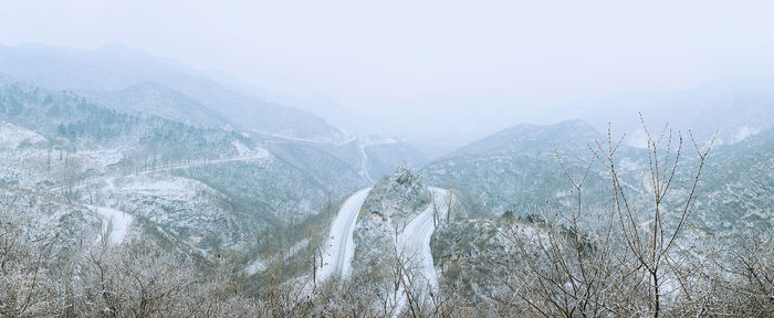 Scenic view of tree mountains against sky