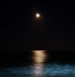 Scenic view of sea against sky at night