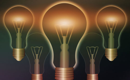 Digital composite image of illuminated light bulb