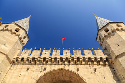 Low angle view of historical building against blue sky