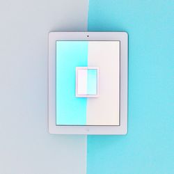 Directly above shot of digital tablet on colored background