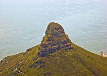 High angle view of lion head mountain against sea