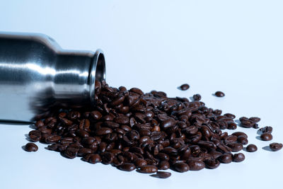 Close-up of coffee beans against white background