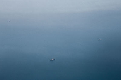 High angle view of boat sailing in sea