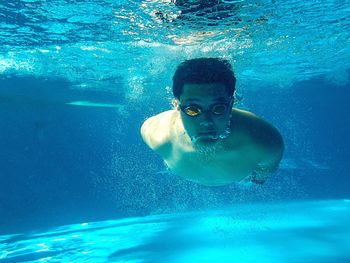 Two people swimming in sea