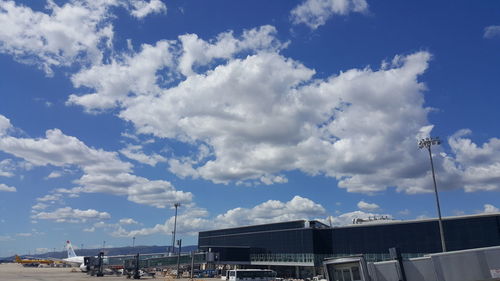 Low angle view of city against blue sky