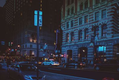 Traffic on city street at night