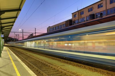 Train at railroad station against sky