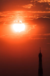 Silhouette of eiffel tower during sunset