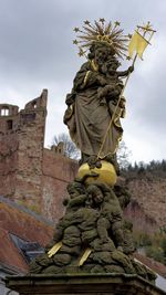 Low angle view of statue against sky