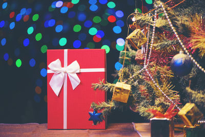 Close-up of christmas tree and present