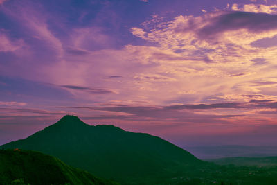 Scenic view of mountains against sky during sunset