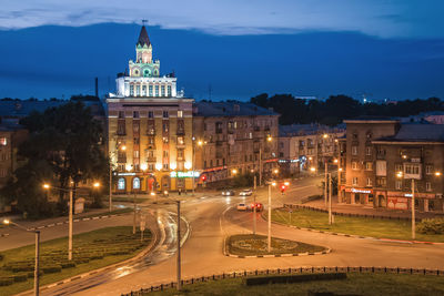 High angle view of city street lit up at night