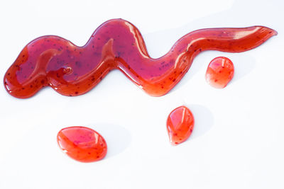 Close-up of candies against white background