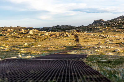 Sunset view of the rusty steel boardwalk between summit of mount kosciuszko and thredbo chairlift