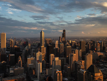 Aerial view of modern buildings in city against sky