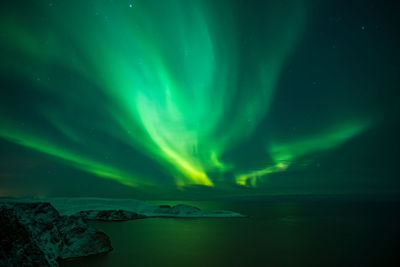 Scenic view of sea against sky at night