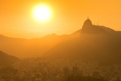 View of buildings in city at sunset