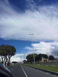 Street by road against sky