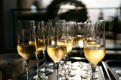 Close-up of wine glasses on table