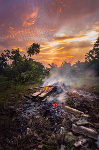 Scenic view of land against sky during sunset