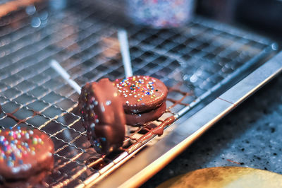 Close-up of chocolate candies on cooling rack