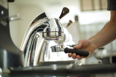 Midsection of man preparing food in kitchen at home