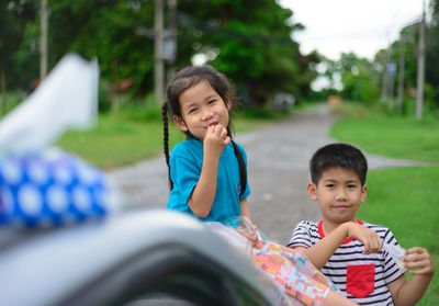 Portrait of happy boy playing in park