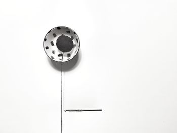 High angle view of electric lamp against white background