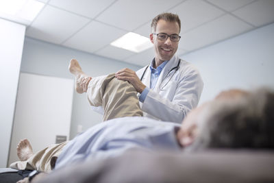 Doctor examiming senior patient in medical practice